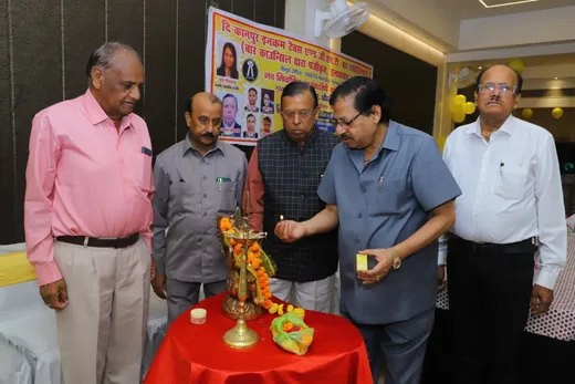 Lighting the lamp at the oath-taking ceremony.